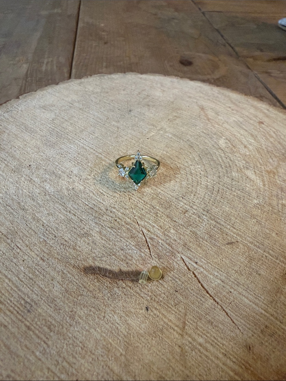 Gold-Tone Ring with Emerald Green Marquise Gem and Clear Accents